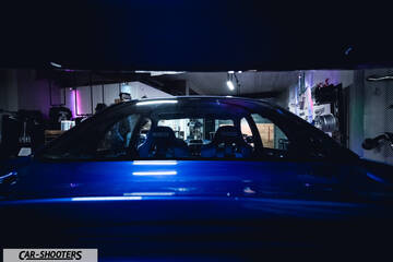 rear view, blue in a garage