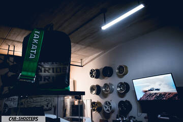 detail, in a garage with wheels on the wall
