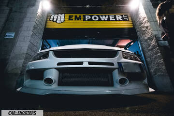 front three-quarter, white in a garage