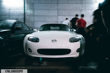 front three-quarter, white in a parking garage