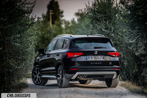 Seat Ateca – rear three-quarter, black on a dirt road