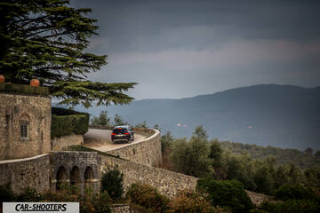 Seat Ateca – rear view, dark blue on a winding country road