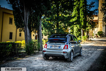 Abarth 695 Rivale – rear three-quarter, silver on a cobbled driveway