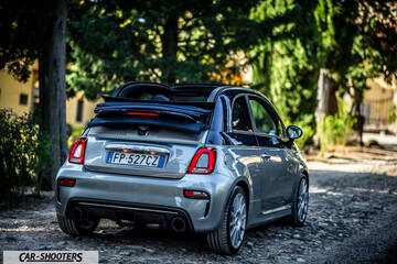 Abarth 695 Rivale – rear three-quarter, silver metallic on a cobbled path