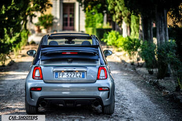 Abarth 695 Rivale – rear view, grey metallic on a stone driveway