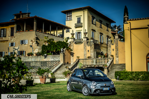 Abarth 695 Rivale – front three-quarter, grey metallic in front of an italian villa