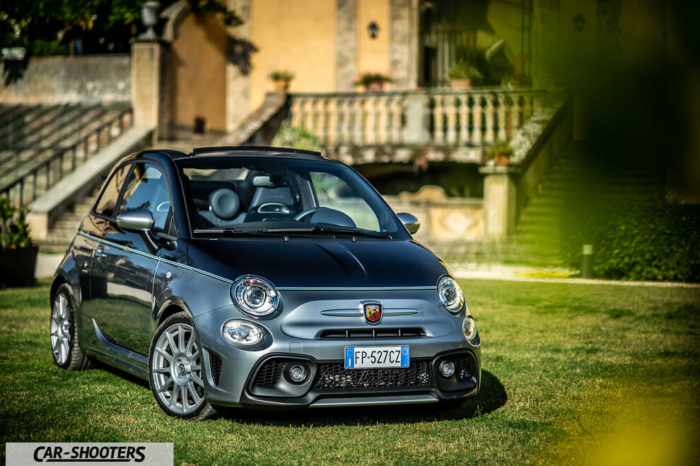 Abarth 695 Rivale – front three-quarter, grey parked on grass in front of a villa