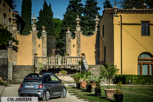 Abarth 695 Rivale – rear three-quarter, grey metallic against an old stone building