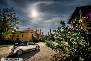 Abarth 695 Rivale – rear three-quarter, silver metallic against an old stone building