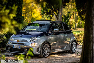 Abarth 695 Rivale – front three-quarter, silver and blue on a gravel path