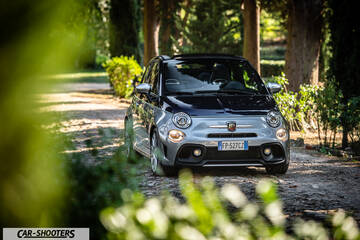 Abarth 695 Rivale – front three-quarter, silver and black on a tree-lined path