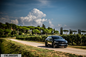 Tesla Model X – front three-quarter, black on a country road