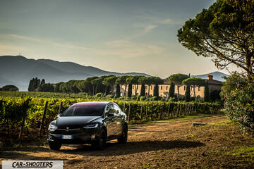 Tesla Model X – front three-quarter, black against a mountain backdrop