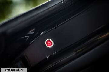 Tesla Model X – detail, red trunk release button close-up