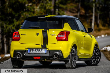 Suzuki Swift Sport – rear three-quarter, yellow on a country road