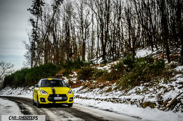 Suzuki Swift Sport – front three-quarter, yellow on a snowy country road