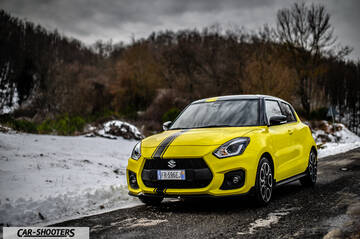 Suzuki Swift Sport – front three-quarter, yellow on a snowy country road