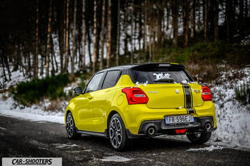 Suzuki Swift Sport – rear three-quarter, yellow on a snowy road