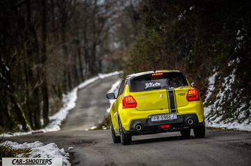 Suzuki Swift Sport – rear three-quarter, yellow on a snowy country road