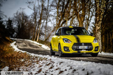 Suzuki Swift Sport – front three-quarter, yellow on a snowy country road