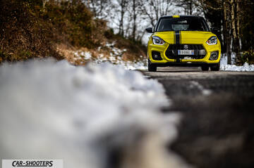 Suzuki Swift Sport – front three-quarter, yellow on a snowy country road