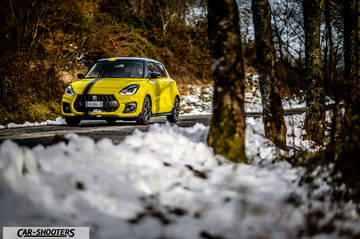 Suzuki Swift Sport – front three-quarter, yellow on a snowy road