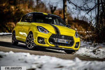 Suzuki Swift Sport – front three-quarter, yellow on a snowy country road