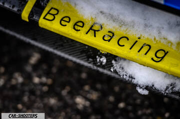 Suzuki Swift Sport – detail, with snow on a bumper sticker