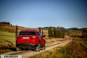 Jeep Compass – rear view, red on a country road
