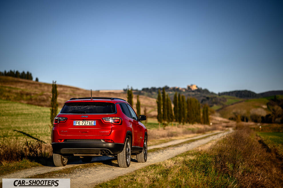 Jeep Compass – rear view, red on a country road