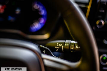 Toyota Corolla Hybrid – detail, steering wheel paddle shifter close-up