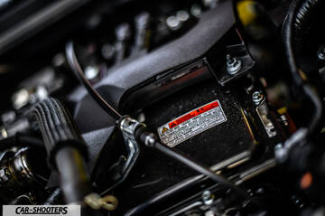Toyota Corolla Hybrid – engine bay, warning label on component