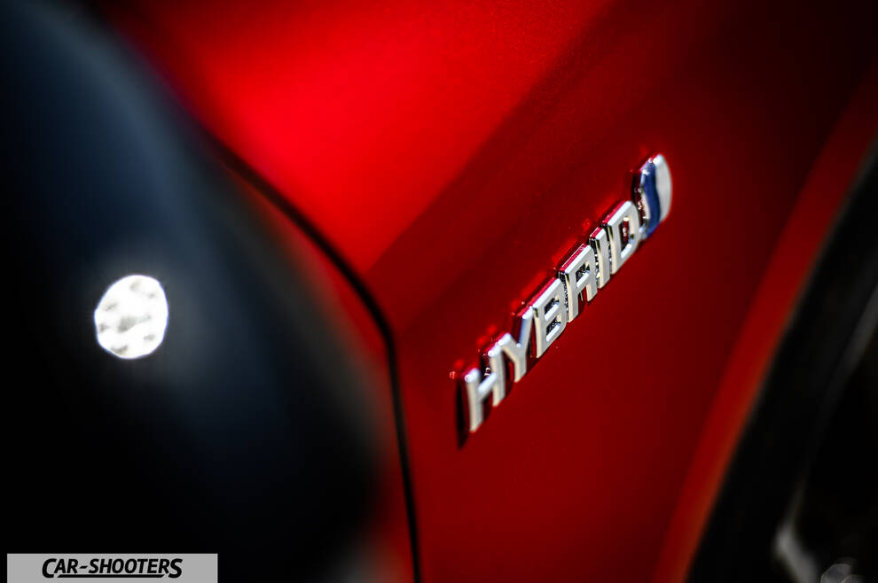 Toyota Corolla Hybrid – detail, hybrid badge close-up