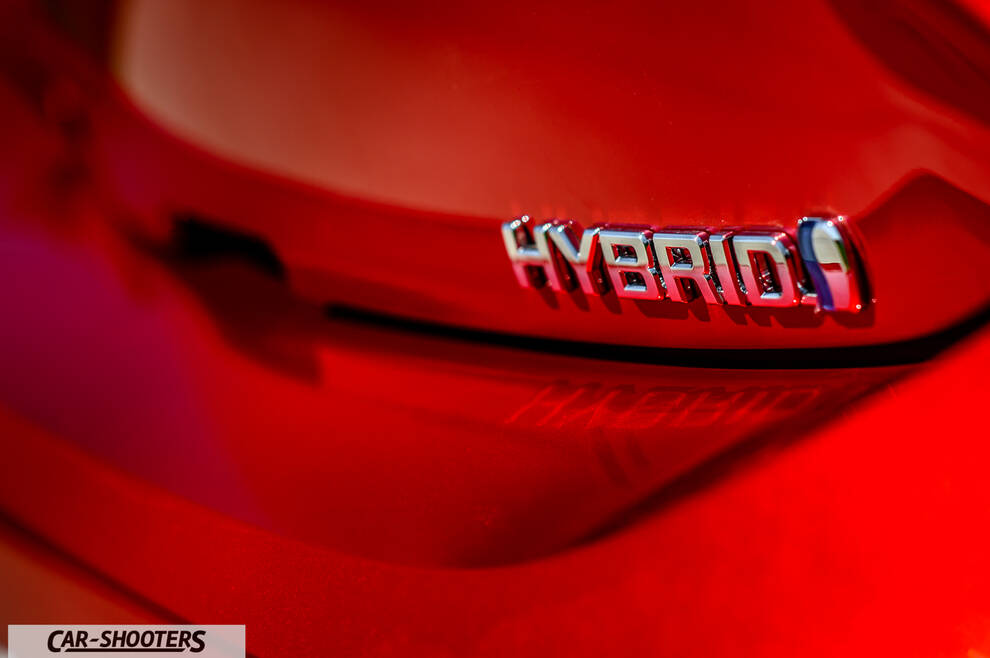Toyota Corolla Hybrid – detail, hybrid badge close-up