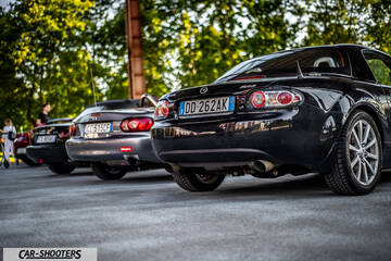 rear three-quarter, black in a parking lot