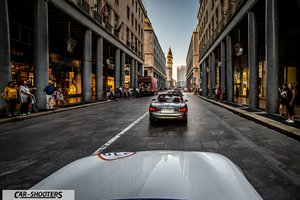 Mazda MX 5 Icon s Day – rear view, silver driving down a city street