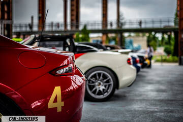 rear three-quarter, red with number four parked in a line
