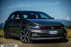 Volkswagen Polo GTI – front three-quarter, grey metallic against a mountain backdrop