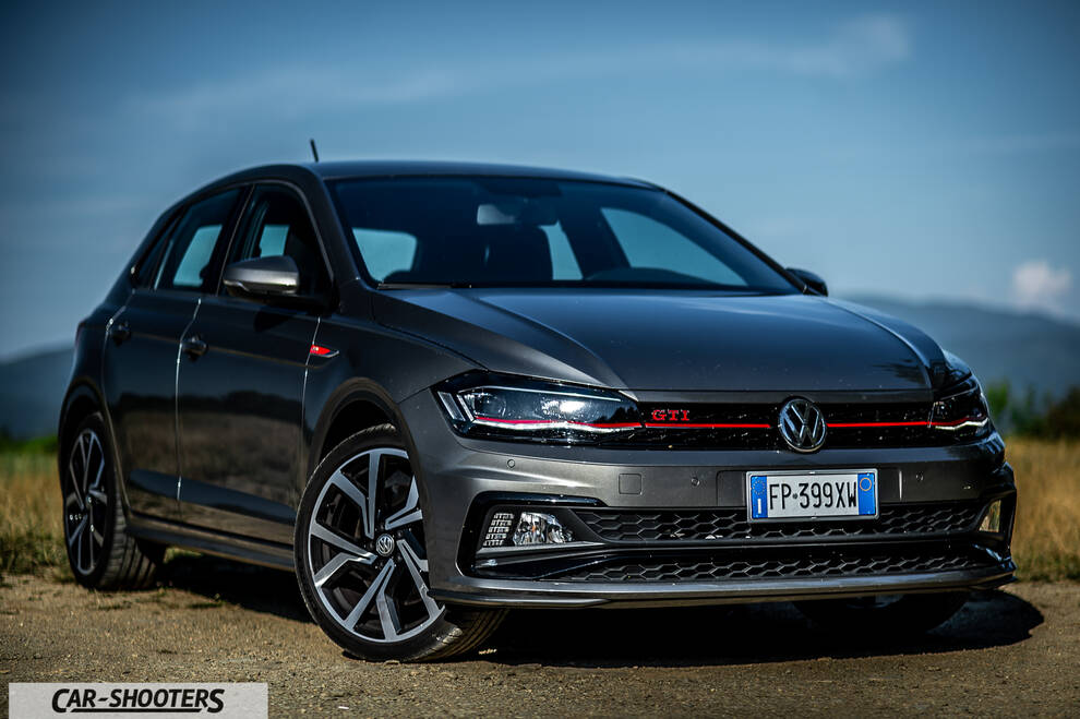 Volkswagen Polo GTI – front three-quarter, grey metallic against a mountain backdrop