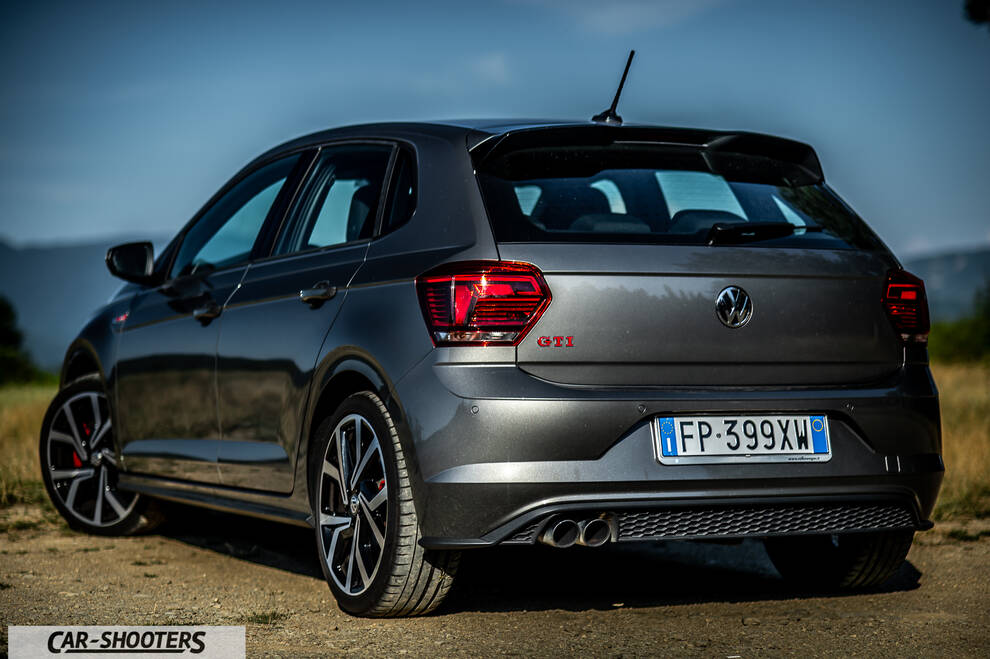Volkswagen Polo GTI – rear three-quarter, grey metallic against a mountain backdrop