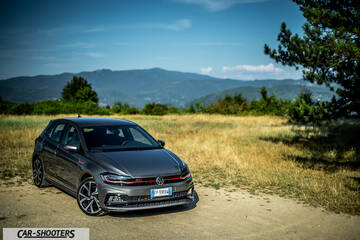 Volkswagen Polo GTI – front three-quarter, grey metallic against a mountain backdrop