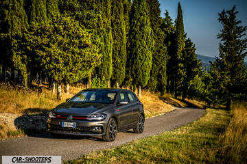 Volkswagen Polo GTI – front three-quarter, grey metallic on a country road