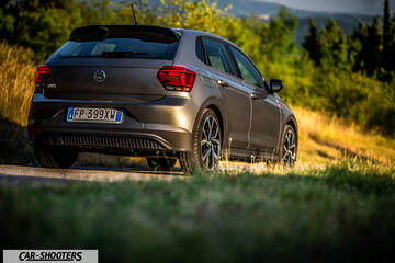 Volkswagen Polo GTI – rear three-quarter, grey metallic on a country road