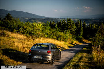Volkswagen Polo GTI – rear three-quarter, grey metallic on a country road