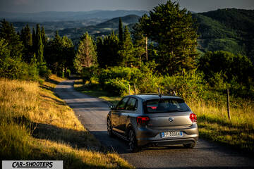 Volkswagen Polo GTI – rear three-quarter, grey metallic on a country road