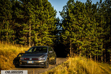 Volkswagen Polo GTI – front three-quarter, grey metallic on a country road
