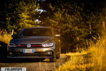 Volkswagen Polo GTI – front three-quarter, grey metallic on a country road