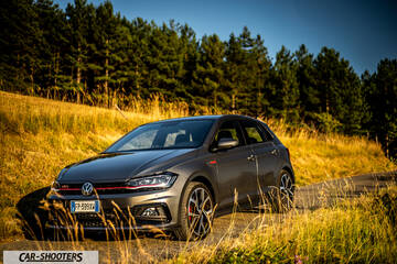 Volkswagen Polo GTI – front three-quarter, grey metallic on a country road