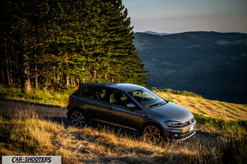 Volkswagen Polo GTI – front three-quarter, grey metallic against a mountain backdrop