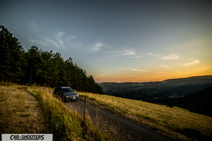 Volkswagen Polo GTI – front three-quarter, grey metallic on a country road